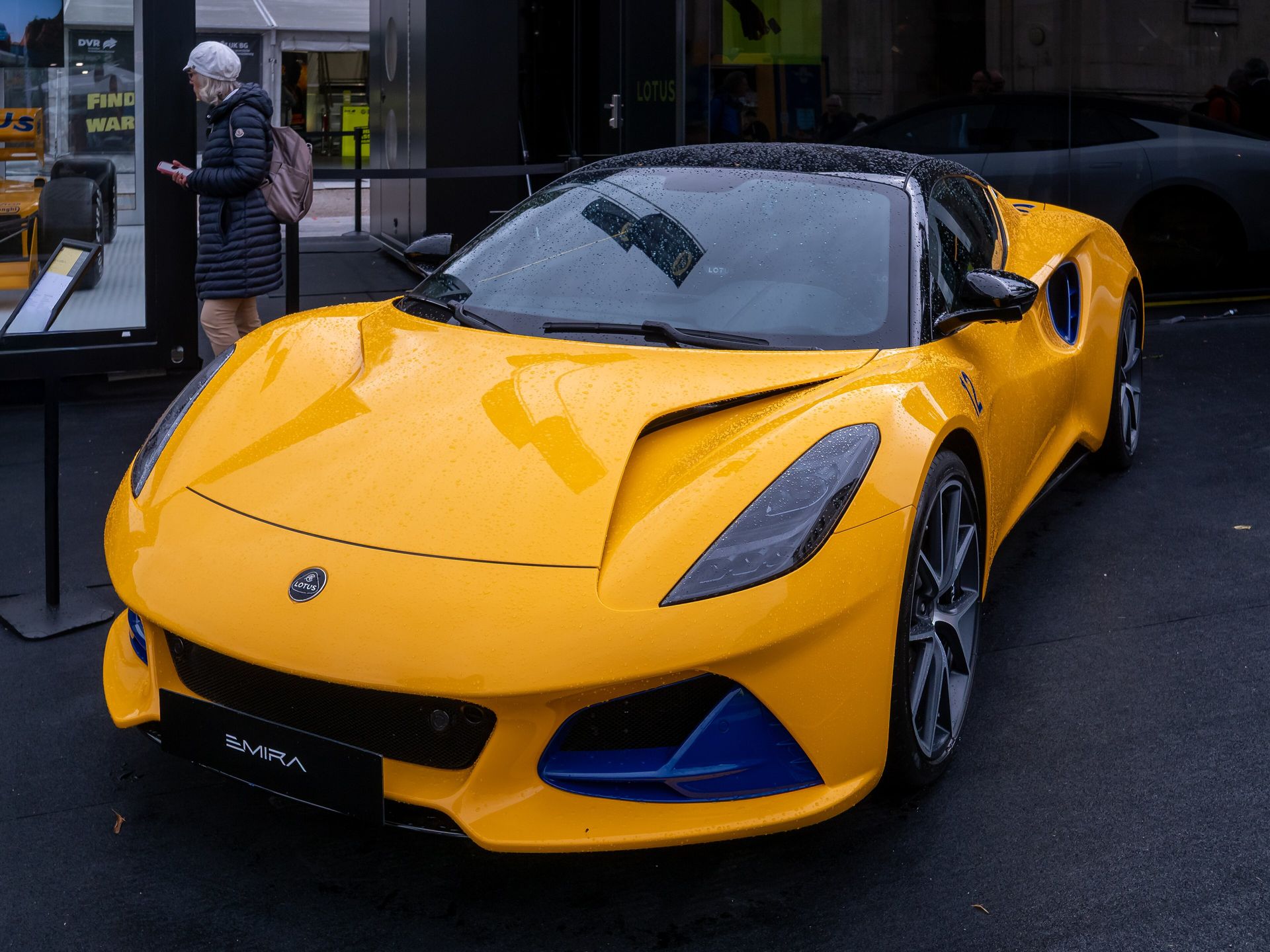 Lotus Emira in Hethel Yellow on a dark show floor